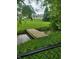 A small wooden bridge and creek offer a tranquil place in the backyard at 922 Eagle Brook Dr, Shelbyville, IN 46176