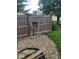 A backyard with a wooden fence and rock features offer a nice touch at 922 Eagle Brook Dr, Shelbyville, IN 46176