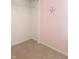 Bedroom with a walk-in closet and decorative unicorn wall decal, creating a welcoming atmosphere at 922 Eagle Brook Dr, Shelbyville, IN 46176
