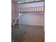 Small bedroom with a white bunk bed featuring an access stairway and neutral carpet at 922 Eagle Brook Dr, Shelbyville, IN 46176