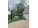 Home's driveway features a basketball hoop, adjacent to the two-car garage at 922 Eagle Brook Dr, Shelbyville, IN 46176
