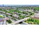 Overhead shot of a neighborhood and cityscape, featuring a canal, mature trees, and diverse architecture under a clear sky at 925 Fayette St, Indianapolis, IN 46202