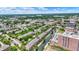 A picturesque aerial view shows a quaint canal flowing through a residential area with lush greenery and well-maintained townhomes at 925 Fayette St, Indianapolis, IN 46202
