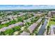 This aerial shot captures a scenic neighborhood with tree-lined streets, well-kept townhomes, and a serene canal under a bright sky at 925 Fayette St, Indianapolis, IN 46202