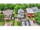 Aerial view of the home's fenced in backyard with patio and shed and adjacent houses at 925 Fayette St, Indianapolis, IN 46202