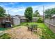 Backyard with small patio, shed and grass at 925 Fayette St, Indianapolis, IN 46202