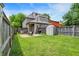 Spacious backyard with a brick patio, storage shed, and privacy fence, perfect for outdoor enjoyment at 925 Fayette St, Indianapolis, IN 46202