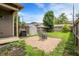 Well-maintained backyard featuring a patio, grill, storage shed and lush green grass at 925 Fayette St, Indianapolis, IN 46202