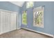 Bright bedroom with vaulted ceilings and plenty of natural light from two large windows at 925 Fayette St, Indianapolis, IN 46202