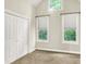 Bright bedroom with vaulted ceiling and windows offering natural light at 925 Fayette St, Indianapolis, IN 46202