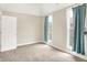 Bright and airy bedroom with soft carpet, neutral walls, and natural light pouring in from a pair of windows at 925 Fayette St, Indianapolis, IN 46202