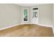 Bright living room with hardwood floors, neutral paint, and ample natural light at 925 Fayette St, Indianapolis, IN 46202