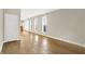 Spacious living room featuring hardwood floors, neutral paint, and plenty of windows for natural light at 925 Fayette St, Indianapolis, IN 46202