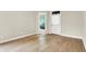 Bright and airy room featuring hardwood floors and natural light from the large window at 925 Fayette St, Indianapolis, IN 46202