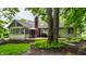 Idyllic backyard with a charming deck, outdoor seating, and a serene wooded backdrop at 9445 Moorings Blvd, Indianapolis, IN 46256