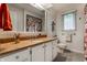 Bathroom featuring granite counters, white cabinetry and a window bringing in natural light at 9445 Moorings Blvd, Indianapolis, IN 46256