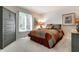 Bedroom with neutral walls, carpet, a large closet, a queen-sized bed, and a nightstand at 9445 Moorings Blvd, Indianapolis, IN 46256