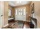 Elegant foyer with gleaming hardwood floors, stylish decor, and a welcoming ambiance at 9445 Moorings Blvd, Indianapolis, IN 46256