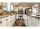 Well-lit kitchen featuring stainless steel appliances, lots of counter space and wood-look floors at 9445 Moorings Blvd, Indianapolis, IN 46256
