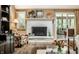 Warm and inviting living room with a charming fireplace, tasteful decor, and access to outdoor spaces at 9445 Moorings Blvd, Indianapolis, IN 46256