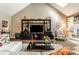 Cozy living room featuring vaulted ceilings, a modern entertainment center, and comfortable seating at 9445 Moorings Blvd, Indianapolis, IN 46256