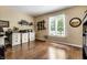 Home office with hardwood floors, a large window, and built-in shelving for organization at 9445 Moorings Blvd, Indianapolis, IN 46256