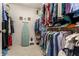 Spacious walk-in closet with ample hanging space and shelving for organized storage at 9445 Moorings Blvd, Indianapolis, IN 46256