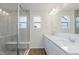 Modern bathroom featuring a glass-enclosed shower and double vanity at 9741 Oleander Dr, Fishers, IN 46250
