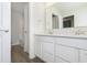 Bright bathroom featuring white cabinets, quartz countertops and chrome fixtures at 9741 Oleander Dr, Fishers, IN 46250