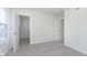 Bedroom features walk-in closet with white wire shelving and light colored carpet at 9741 Oleander Dr, Fishers, IN 46250