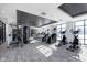 Well-lit gym featuring modern equipment, including treadmills, ellipticals, and weight machines at 9741 Oleander Dr, Fishers, IN 46250