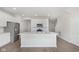 Bright kitchen featuring stainless steel appliances, white cabinets, and a kitchen island at 9741 Oleander Dr, Fishers, IN 46250