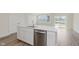 Spacious kitchen featuring stainless steel appliances, white countertops, and hardwood flooring at 9741 Oleander Dr, Fishers, IN 46250