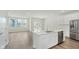 Bright, airy kitchen with island, stainless steel appliances, and hardwood floors. Lots of natural light at 9741 Oleander Dr, Fishers, IN 46250