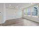 Hardwood floors, a clean look and multiple windows make this living space light and airy at 9741 Oleander Dr, Fishers, IN 46250
