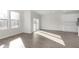 Spacious living room with hardwood floors and sliding doors with natural light at 9741 Oleander Dr, Fishers, IN 46250