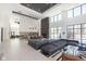 Spacious lounge area with comfortable seating, modern lighting, and a refreshment bar at 9741 Oleander Dr, Fishers, IN 46250