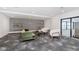 Comfortable lounge area with sofa, chairs, and decorative shelves at 9741 Oleander Dr, Fishers, IN 46250