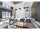 Inviting lounge area with a large sectional sofa, billiard table, and modern design elements at 9741 Oleander Dr, Fishers, IN 46250