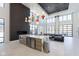Modern lounge with marble island, fireplace, and large windows offering plenty of natural light at 9741 Oleander Dr, Fishers, IN 46250