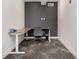Small office equipped with an adjustable desk, chair, and modern decor at 9741 Oleander Dr, Fishers, IN 46250