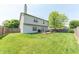 The backyard has a large lawn, deck and privacy fence at 977 Canary Creek Dr, Franklin, IN 46131
