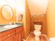 Small bathroom features a wood vanity, toilet, and custom wall and ceiling paint at 977 Canary Creek Dr, Franklin, IN 46131
