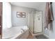 Bathroom area showcases a luxurious white tub and a glass-enclosed shower stall at 977 Canary Creek Dr, Franklin, IN 46131