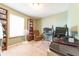 Cozy bedroom with a computer desk, bookshelf, and lots of natural light at 977 Canary Creek Dr, Franklin, IN 46131