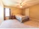 Bright bedroom with carpet, ceiling fan, a window for natural light and neutral paint at 977 Canary Creek Dr, Franklin, IN 46131