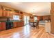 Open kitchen area offering hardwood floors and seamless flow to the dining and living area at 977 Canary Creek Dr, Franklin, IN 46131