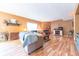 Comfortable living room showcasing hardwood floors and inviting fireplace at 977 Canary Creek Dr, Franklin, IN 46131