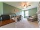 Comfortable home office features a ceiling fan, desk, chair, and built-in bookshelves at 977 Canary Creek Dr, Franklin, IN 46131