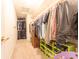 Spacious walk-in closet with extensive shelving and hanging racks for optimal storage at 977 Canary Creek Dr, Franklin, IN 46131